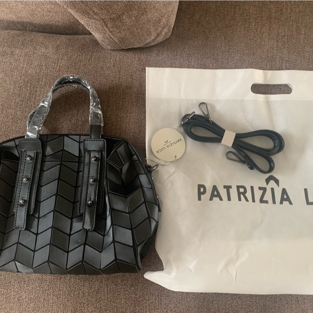 Patrizia Luca geometric small sachet with handle and strap.